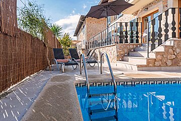 A swimming pool with a staircase leading to it