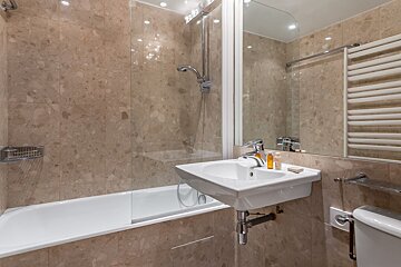 A bathroom with a sink and a bathtub