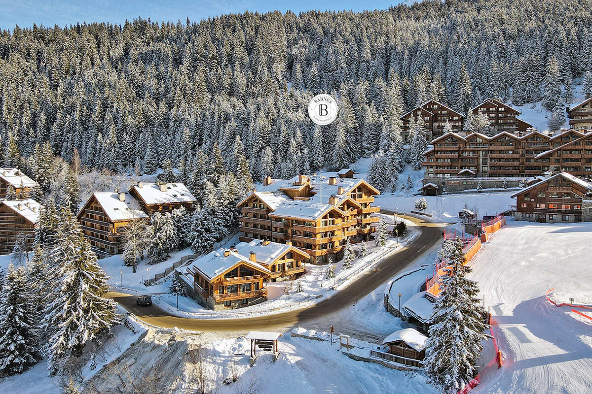 An aerial view of a ski resort with the letter b on it