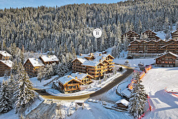 An aerial view of a ski resort with the letter b on it
