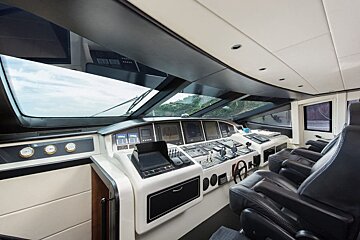A cockpit of a boat with a monitor that says ' gps ' on it