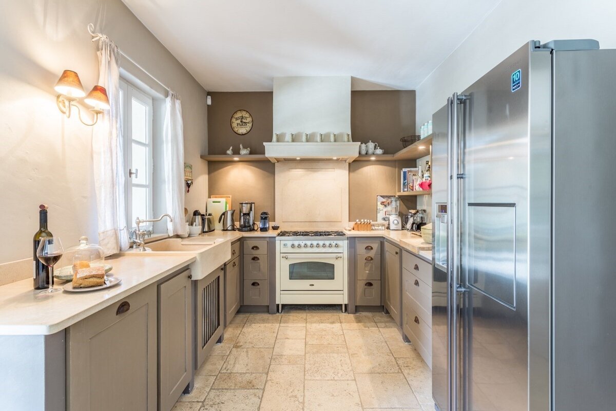 A kitchen with a stainless steel refrigerator that says ' samsung ' on it