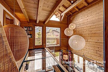 A wooden house with a sign that says knight frank