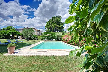 A large swimming pool with the words made in provence on it