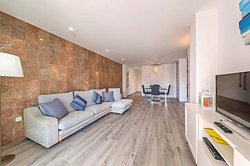 A living room with a couch and a flat screen tv