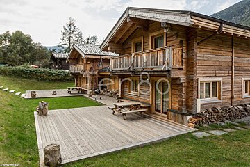A wooden house with the number 80 on the side