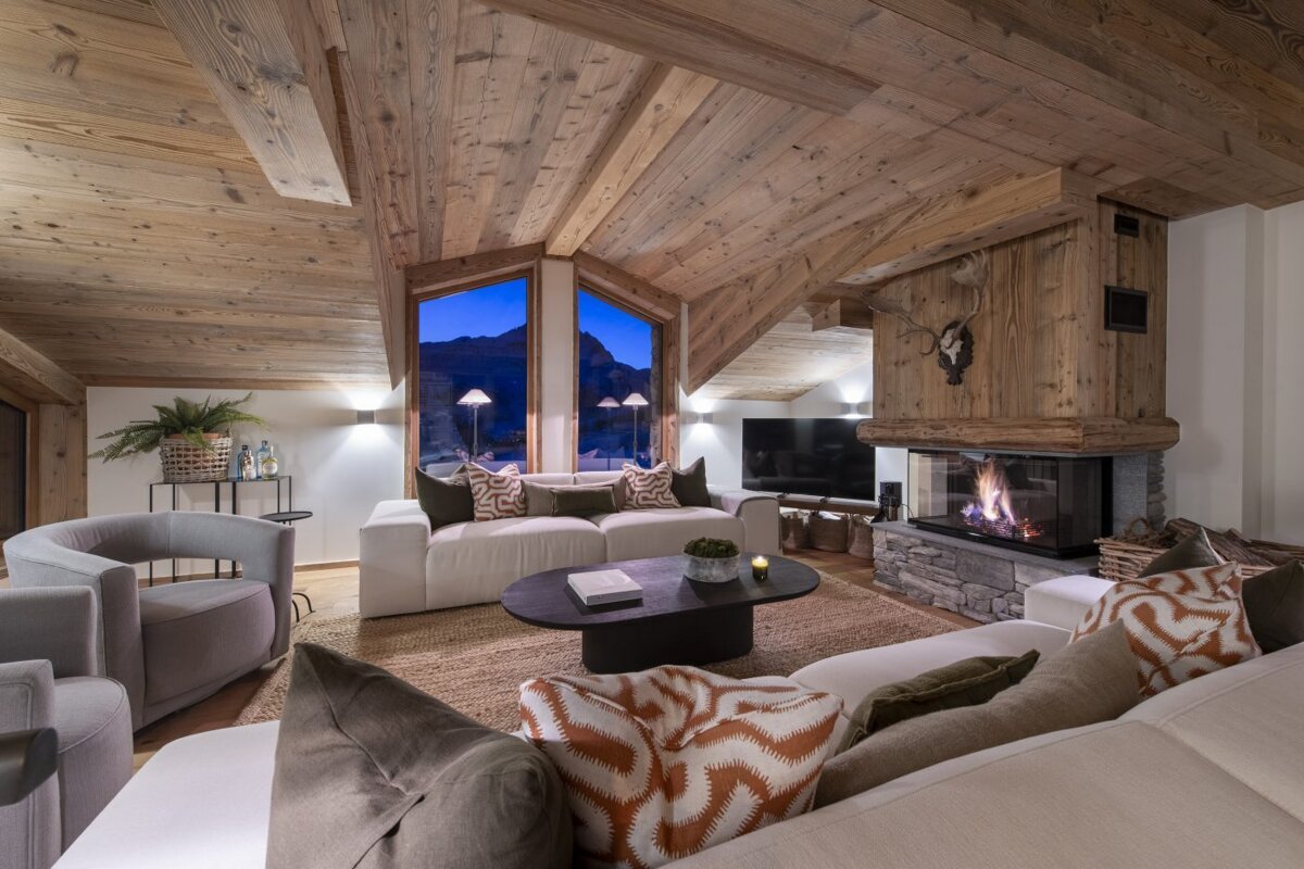 A living room filled with furniture and a fireplace