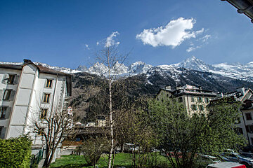 A view of a city with mountains in the background