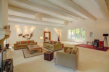 A living room filled with furniture and a fireplace