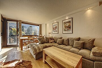 A living room with a couch and a coffee table