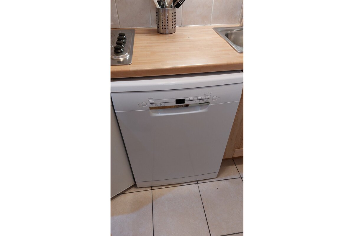 A bosch dishwasher sits on a kitchen counter