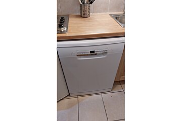 A bosch dishwasher sits on a kitchen counter