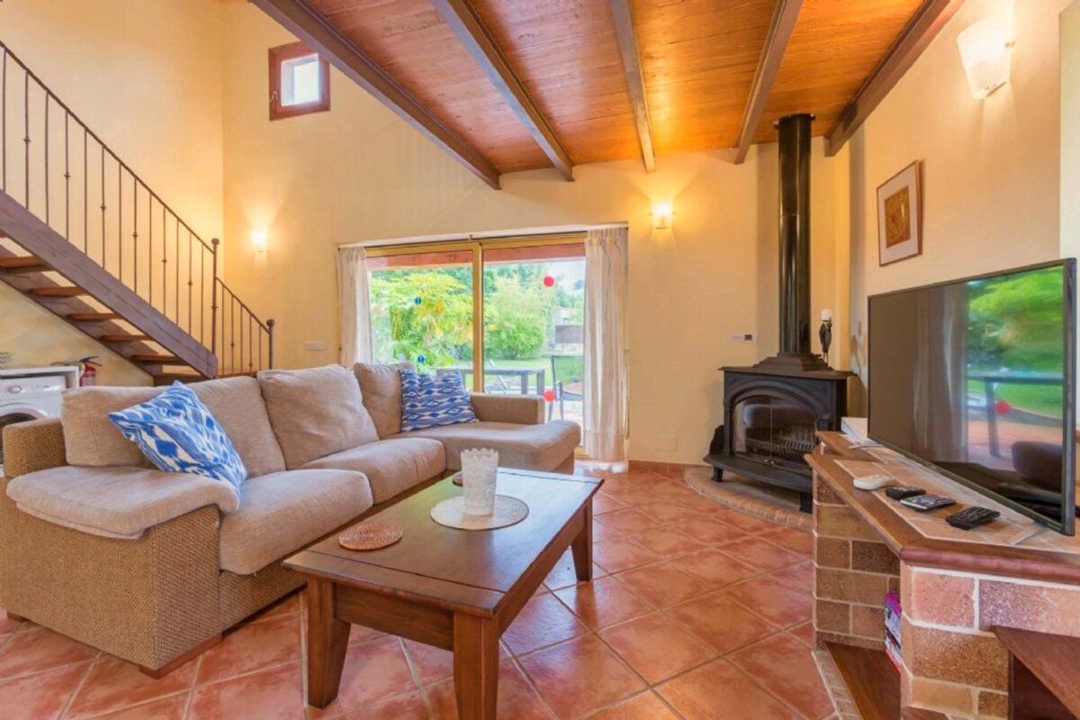 A living room with a couch and a flat screen tv