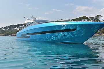 A large blue boat is floating in the water