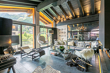 A living room filled with furniture and a large window