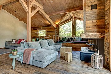 A living room with a couch and a fireplace and the word holidays on the bottom