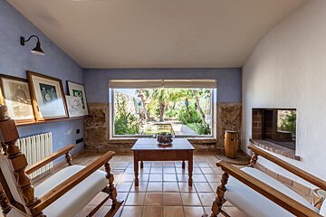 A living room with two rocking chairs and a table