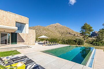 A large swimming pool with a mountain in the background