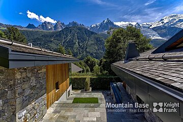 A house with a roof that says mountain base on it