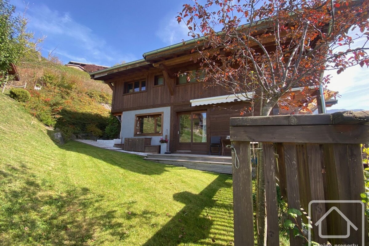 A house with a wooden fence in front of it