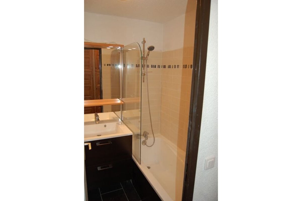 A bathroom with a sink and a bathtub