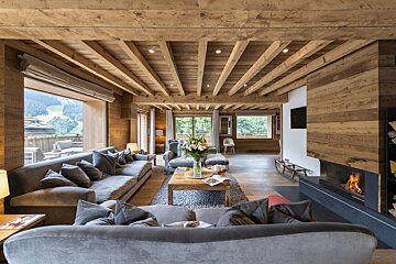 A living room filled with furniture and a fireplace