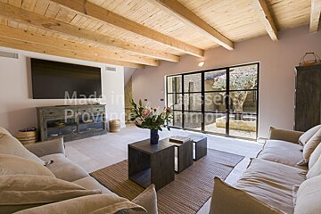 A living room with a couch and a television that says made in provence