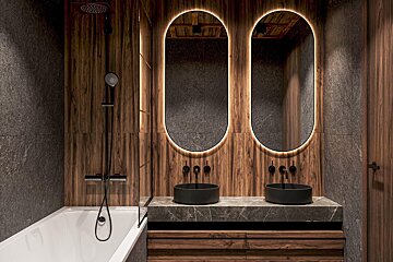 A bathroom with two sinks and two mirrors