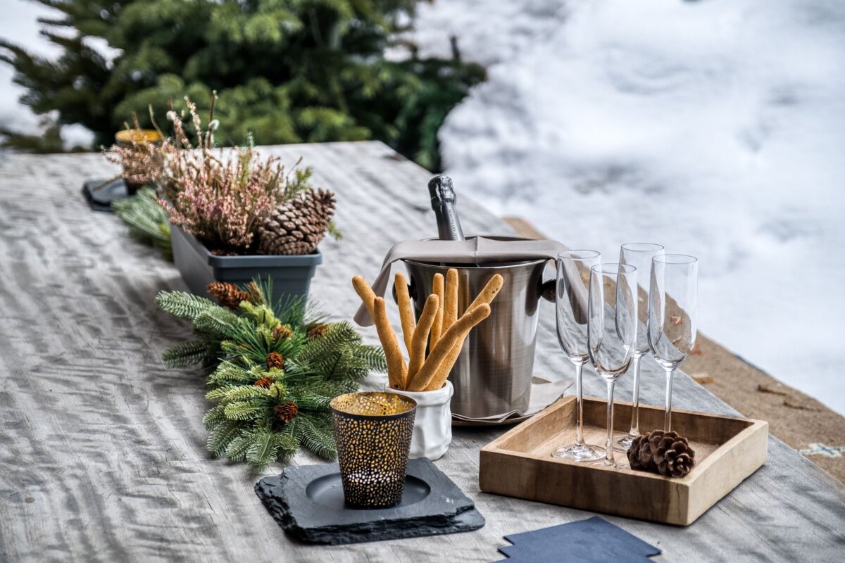 A table with a bottle of champagne and glasses on it