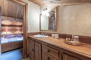A bathroom with two sinks and a towel rack