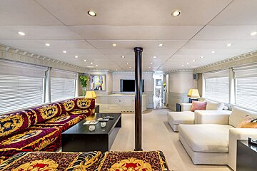 A living room with a couch that has a leopard print on it