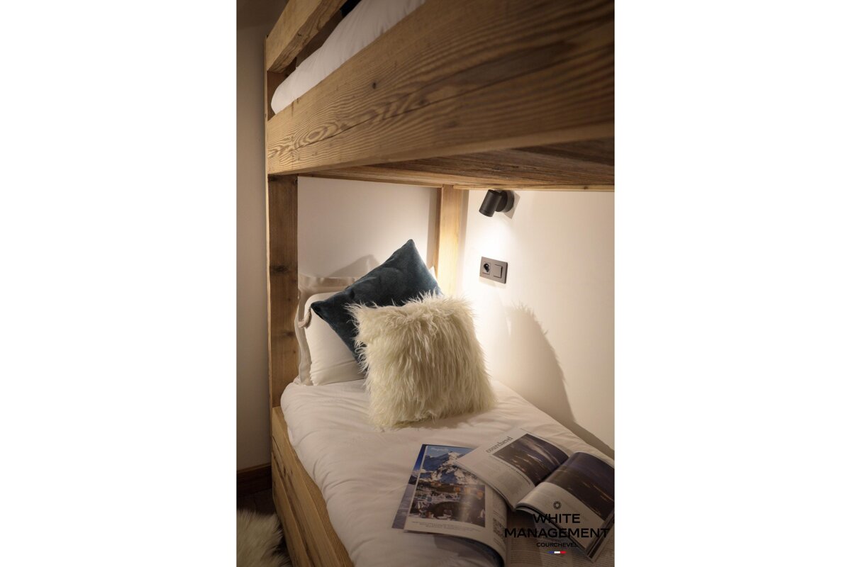 A large house with a balcony and a satellite dish on the roof