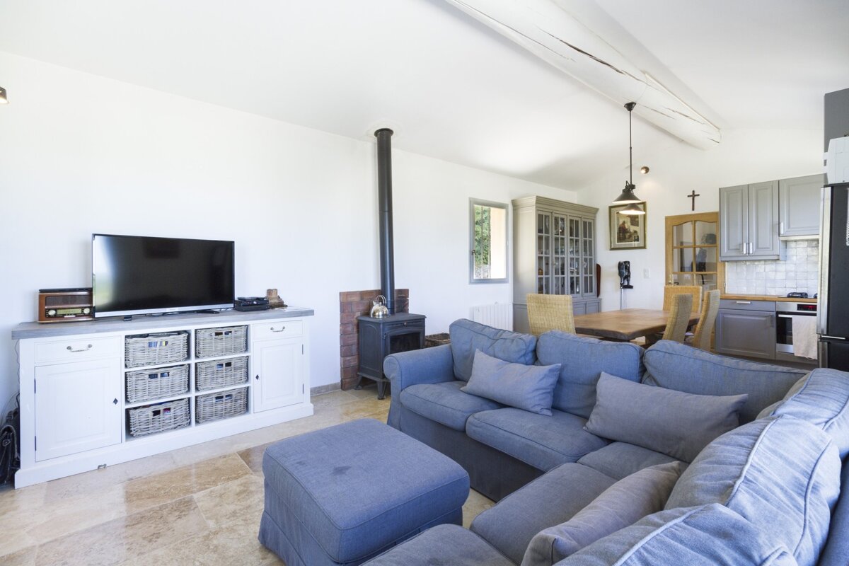A living room with a couch and a flat screen tv