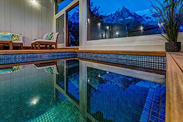 A swimming pool with a mountain in the background