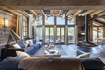 A living room filled with furniture and a fireplace