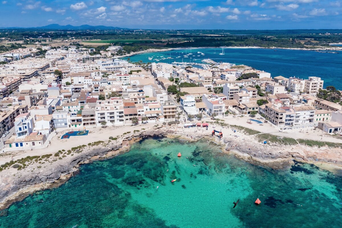 An aerial view of a small town on a sunny day