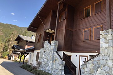 A wooden building with stairs leading up to it