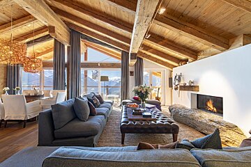A living room with a fireplace and a couch
