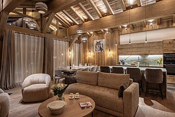 A living room with a couch and a book on the table
