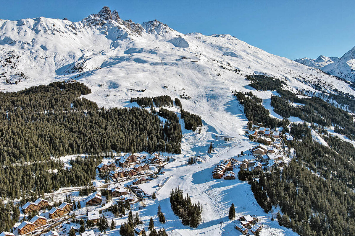 An aerial view of a ski resort in the mountains