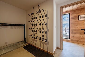 A wall with a bunch of clothes hanging on it
