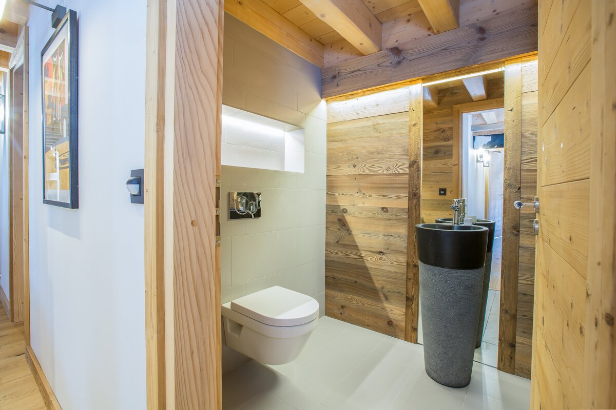 A bathroom with a toilet and a sink in it