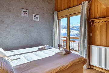 A bedroom with a bed and a sign that says spirit