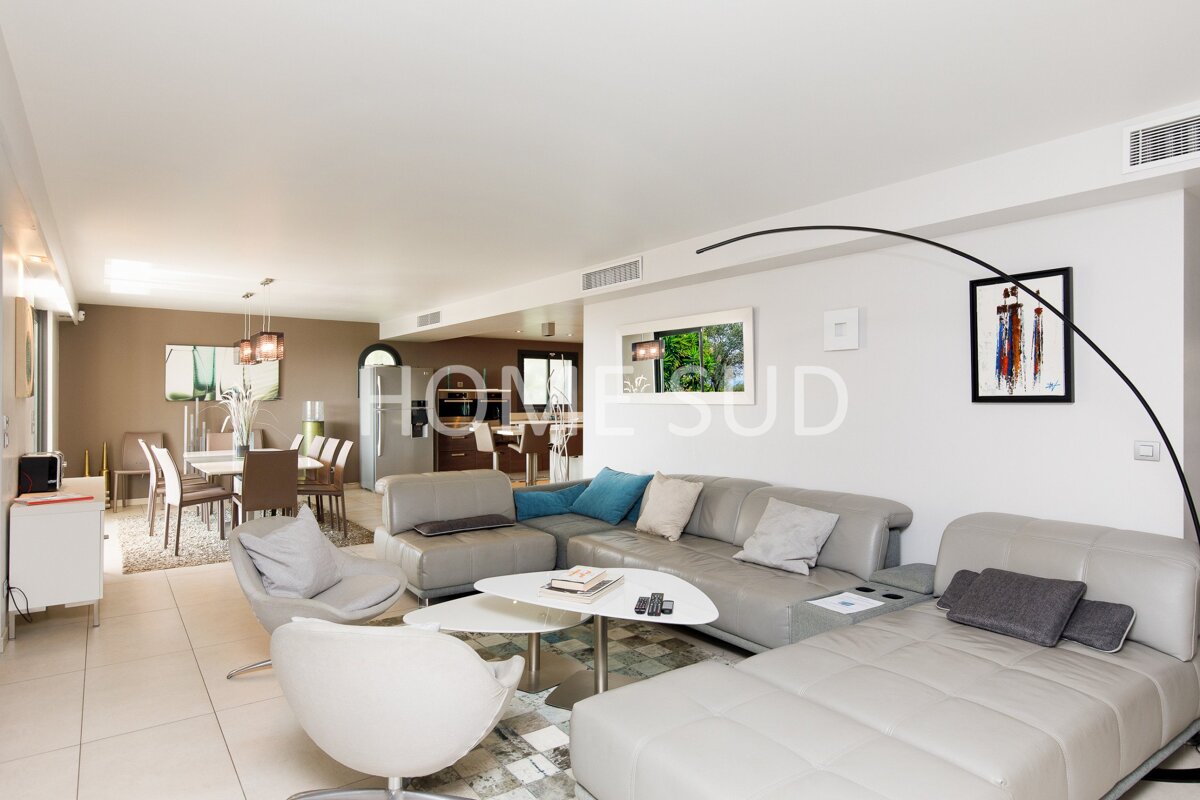 A living room with a couch that says home sud on it