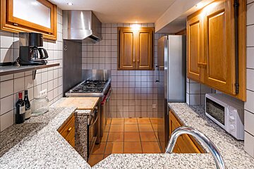 A kitchen with stainless steel appliances and granite counter tops