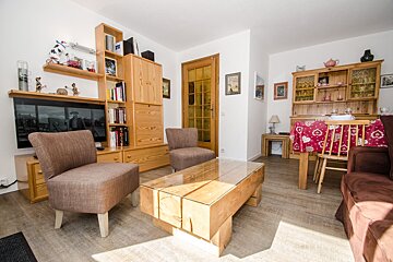 A living room with two chairs and a coffee table
