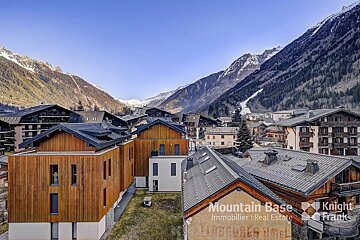 An aerial view of a mountain base immobilier real estate