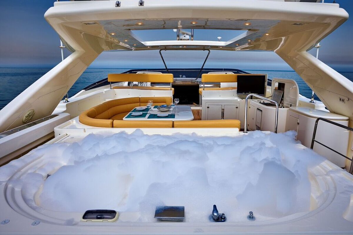 A boat with a jacuzzi in the back of it