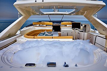 A boat with a jacuzzi in the back of it