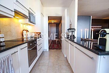 A kitchen with the word home on the bottom